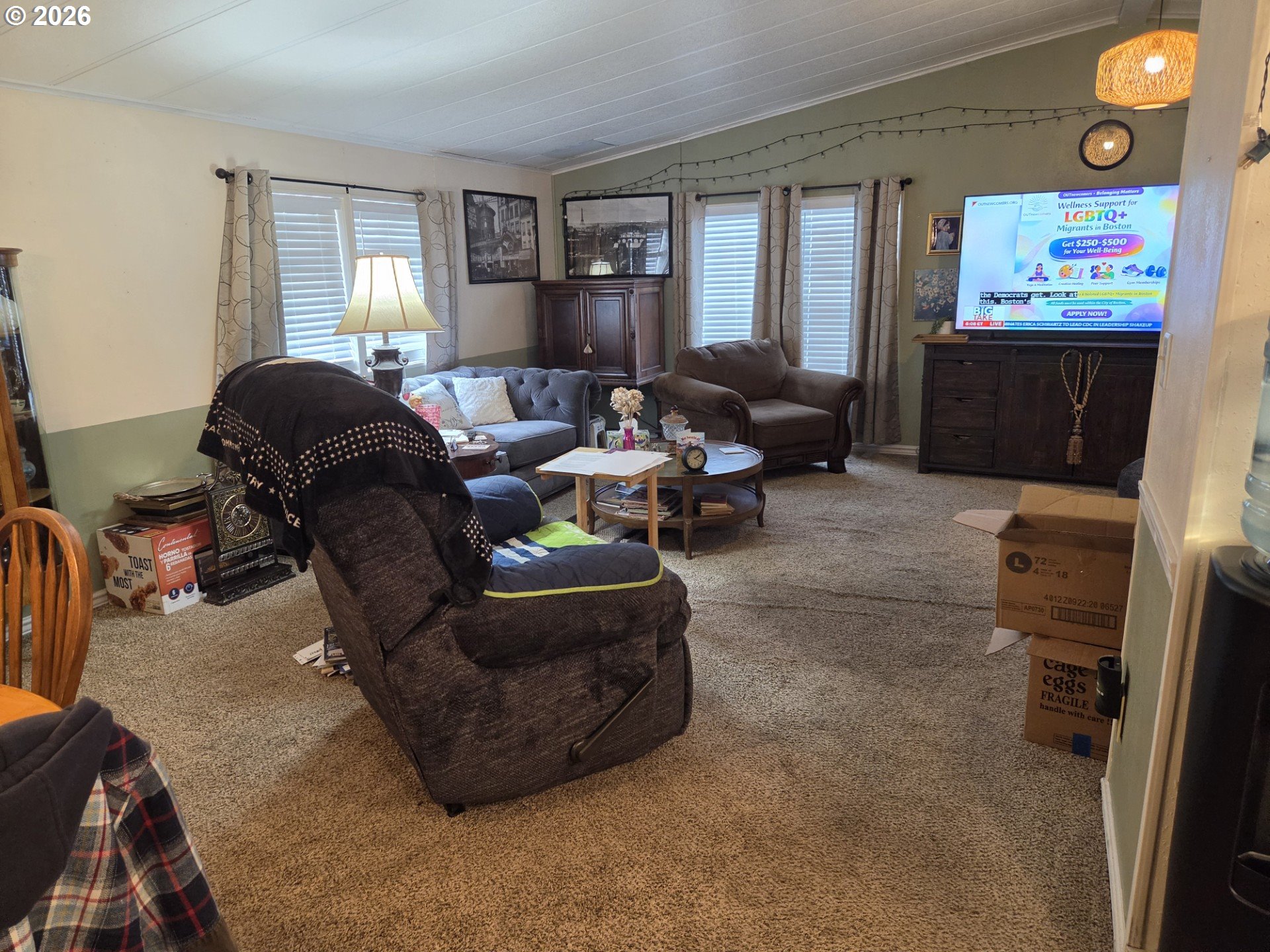428 South State Street Sutherlin, OR 97479 - Photo 9 of 10 a living room with furniture and a flat screen tv