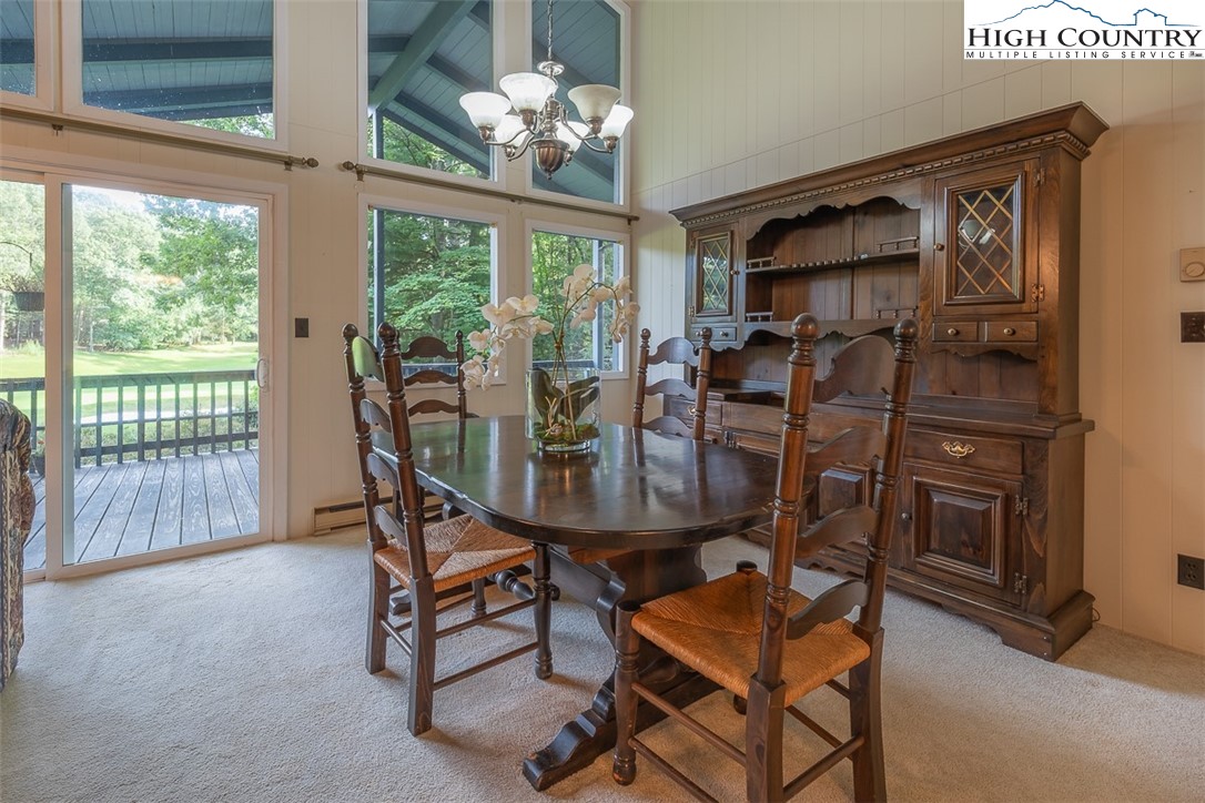377 Deer Run Road Glade Valley, NC 28627 - Photo 15 of 26 a view of a dining room with furniture window and outside view