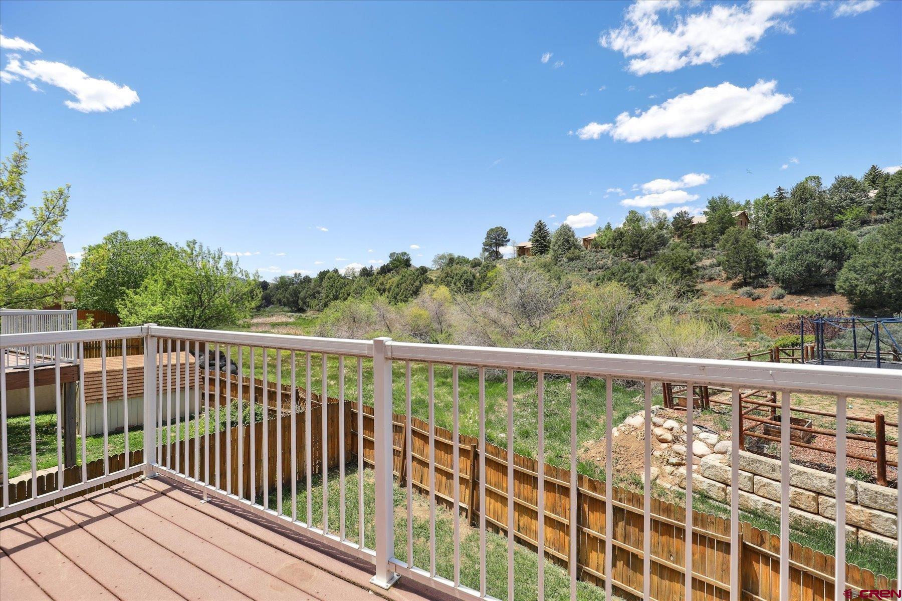 331 Jenkins Ranch Road Durango, CO 81301 - Photo 11 of 35 a view of a balcony with wooden floor & fence