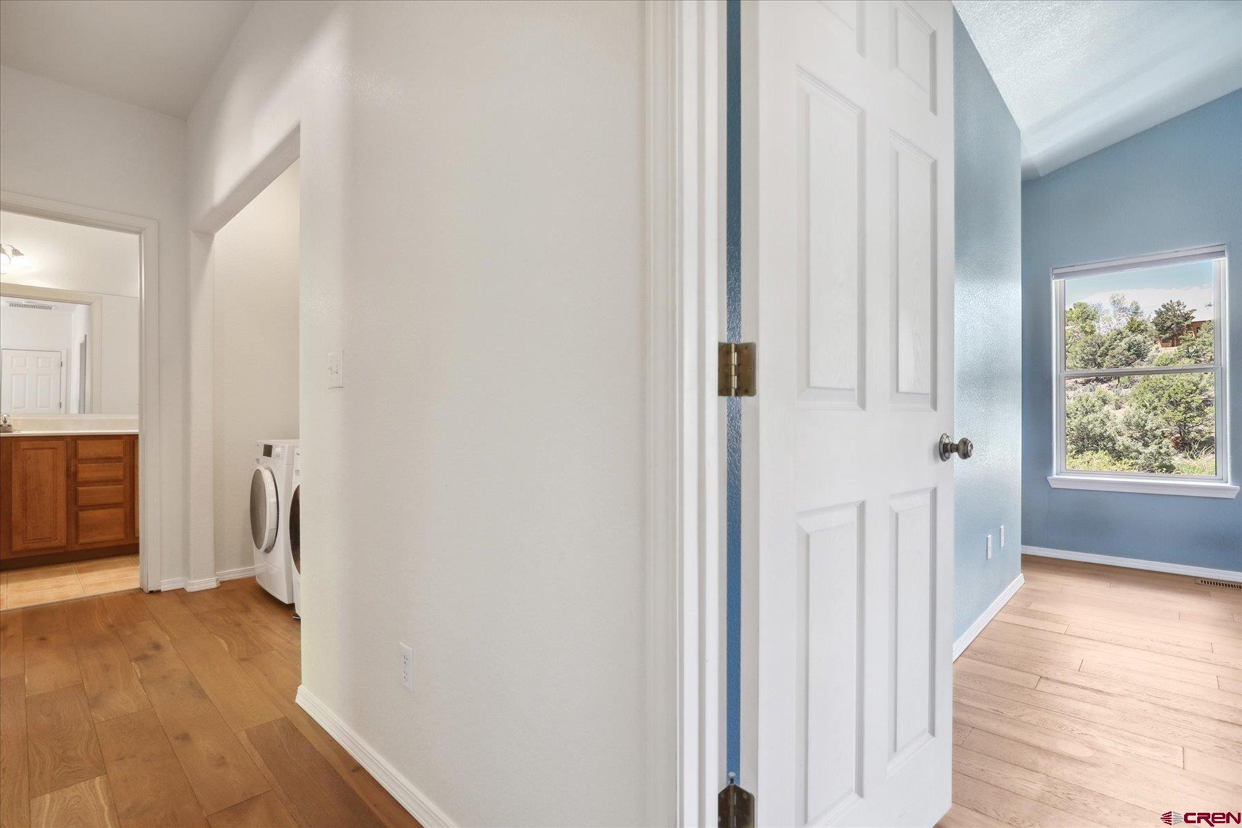 331 Jenkins Ranch Road Durango, CO 81301 - Photo 14 of 35 a view of a hallway with wooden floor and cabinet