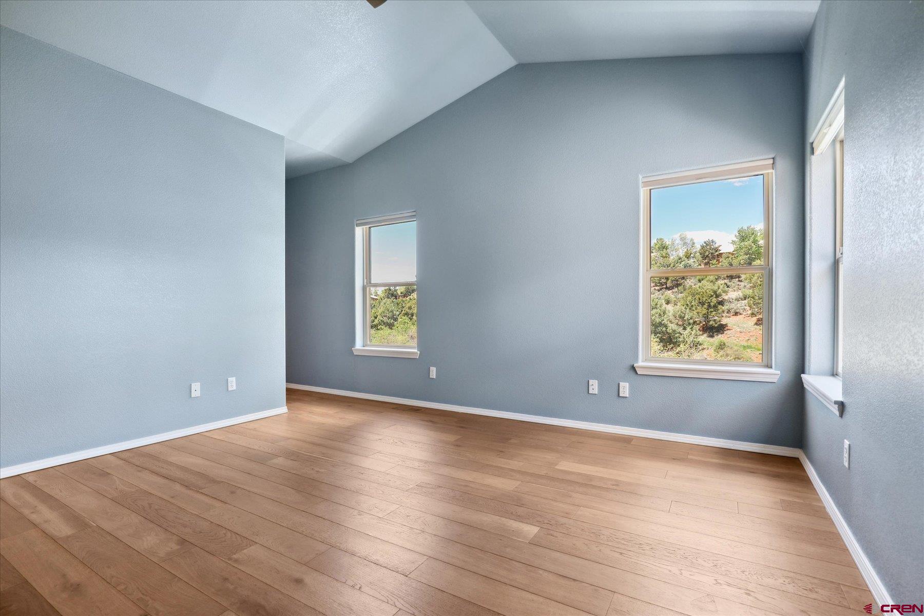 331 Jenkins Ranch Road Durango, CO 81301 - Photo 16 of 35 a view of an empty room with window and wooden floor