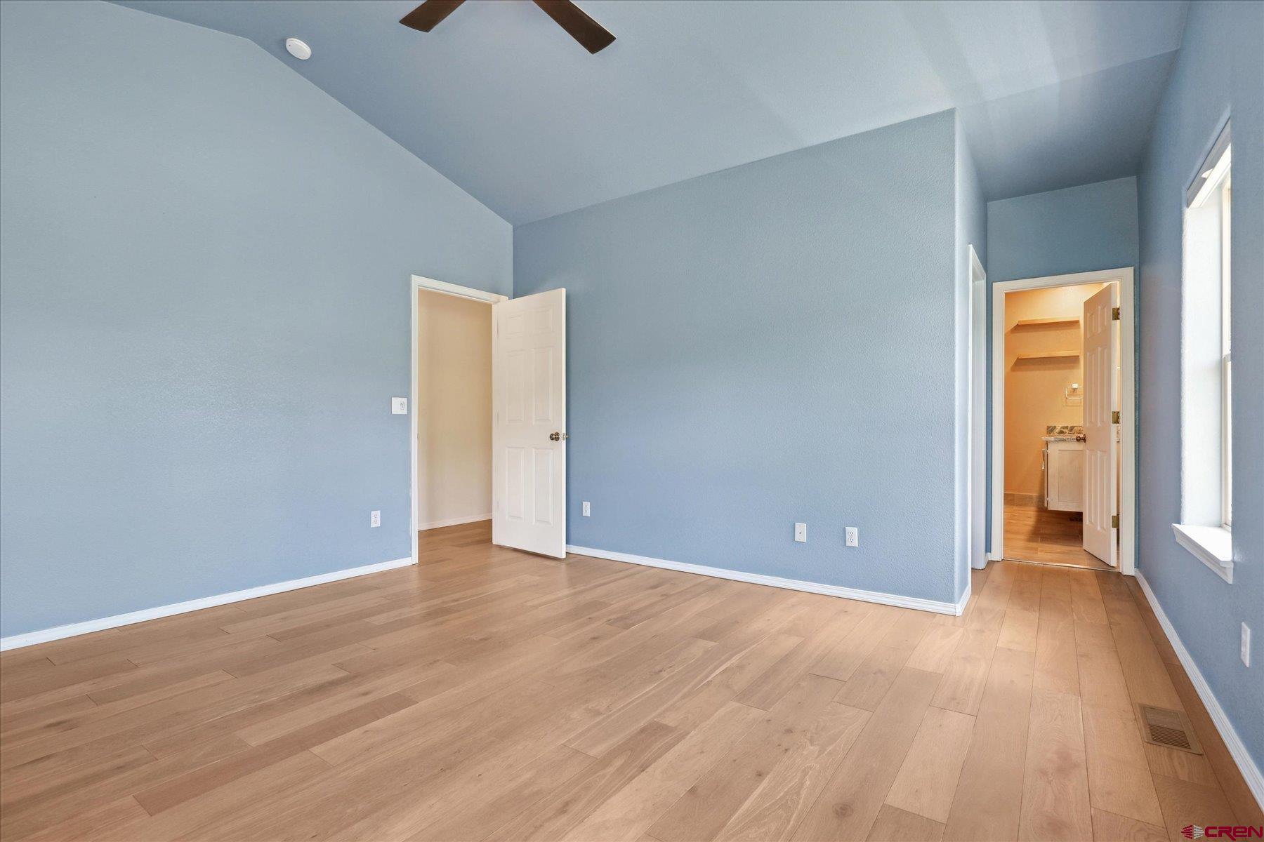 331 Jenkins Ranch Road Durango, CO 81301 - Photo 17 of 35 a view of an empty room with wooden floor and a window