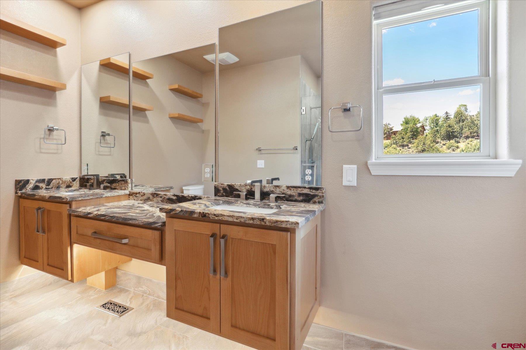 331 Jenkins Ranch Road Durango, CO 81301 - Photo 18 of 35 a kitchen with a sink and cabinets