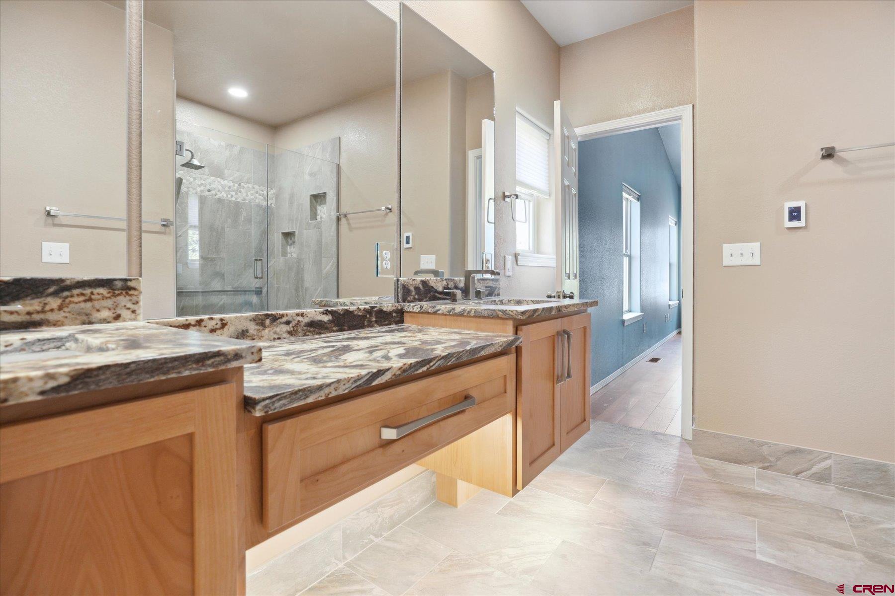 331 Jenkins Ranch Road Durango, CO 81301 - Photo 20 of 35 a large kitchen with granite countertop a sink and a stove