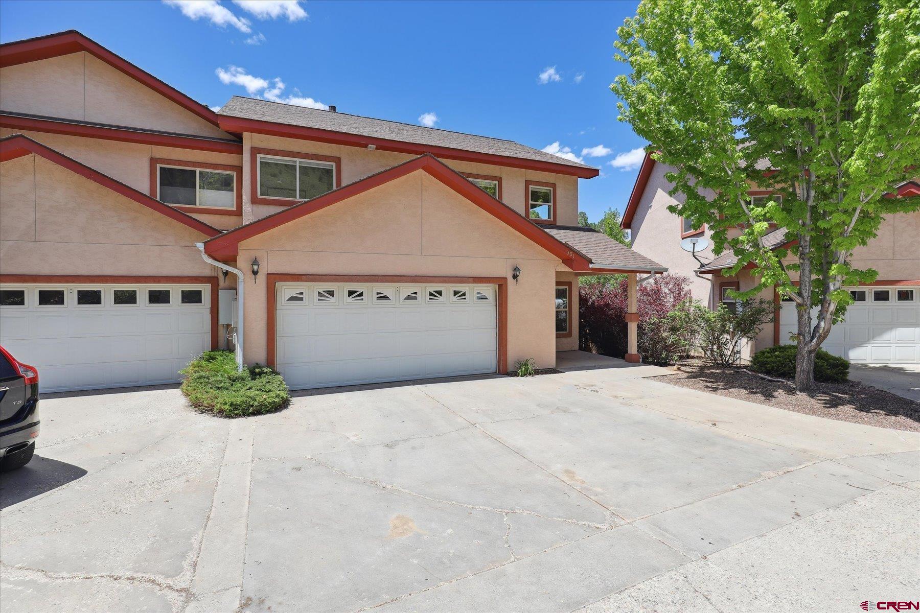 331 Jenkins Ranch Road Durango, CO 81301 - Photo 2 of 35 a front view of a house with garden
