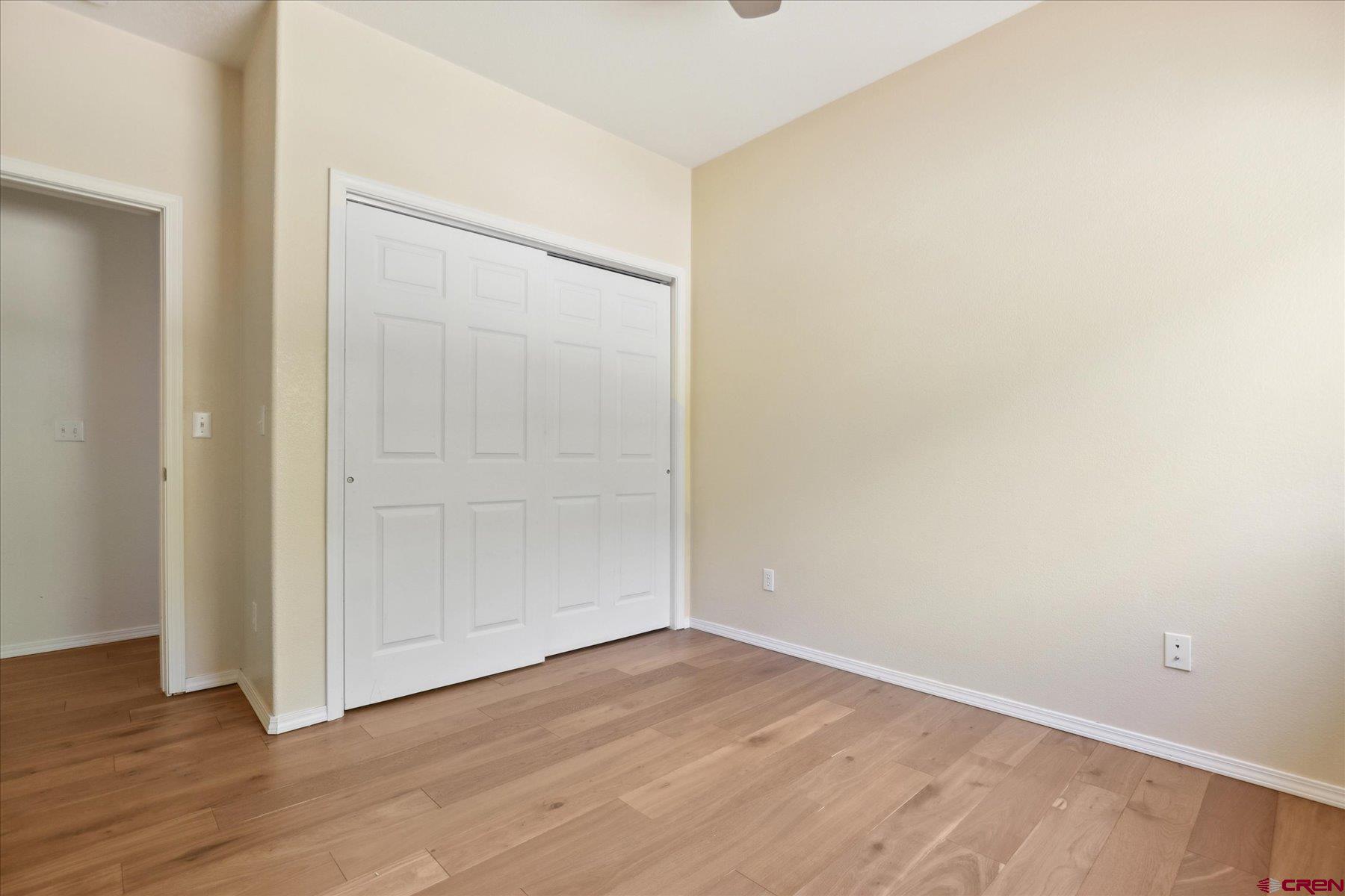331 Jenkins Ranch Road Durango, CO 81301 - Photo 24 of 35 an empty room with wooden floor