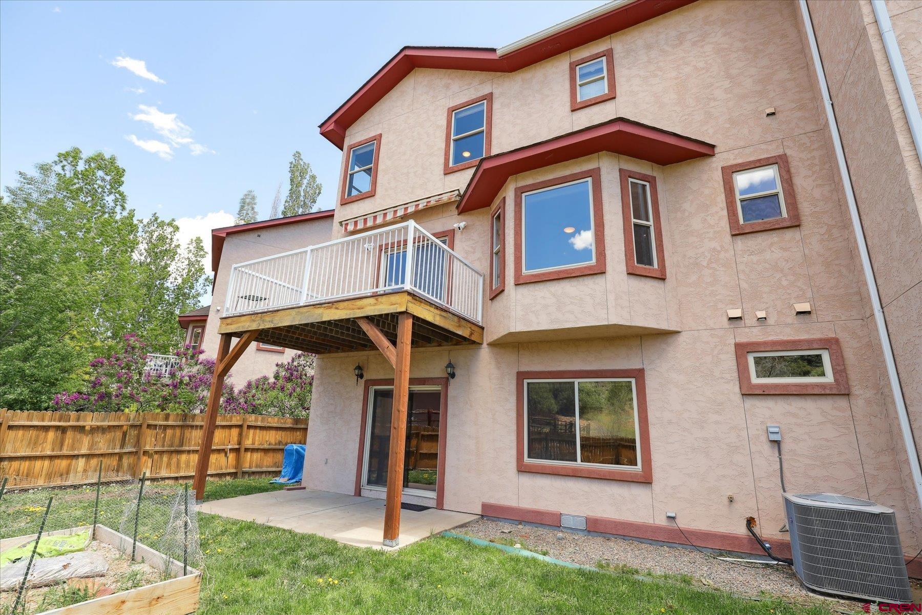 331 Jenkins Ranch Road Durango, CO 81301 - Photo 35 of 35 a front view of a house with garden