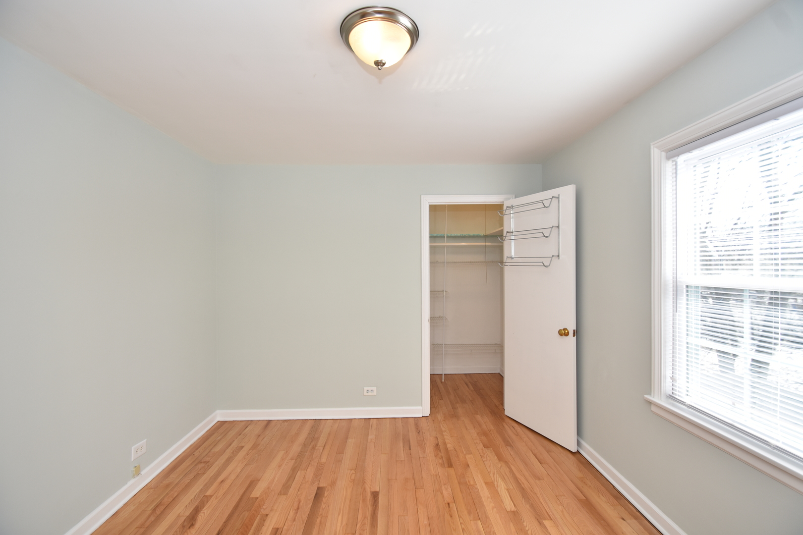735 East Golf Road Des Plaines, IL 60016 - Photo 22 of 31 an empty room with wooden floor and windows