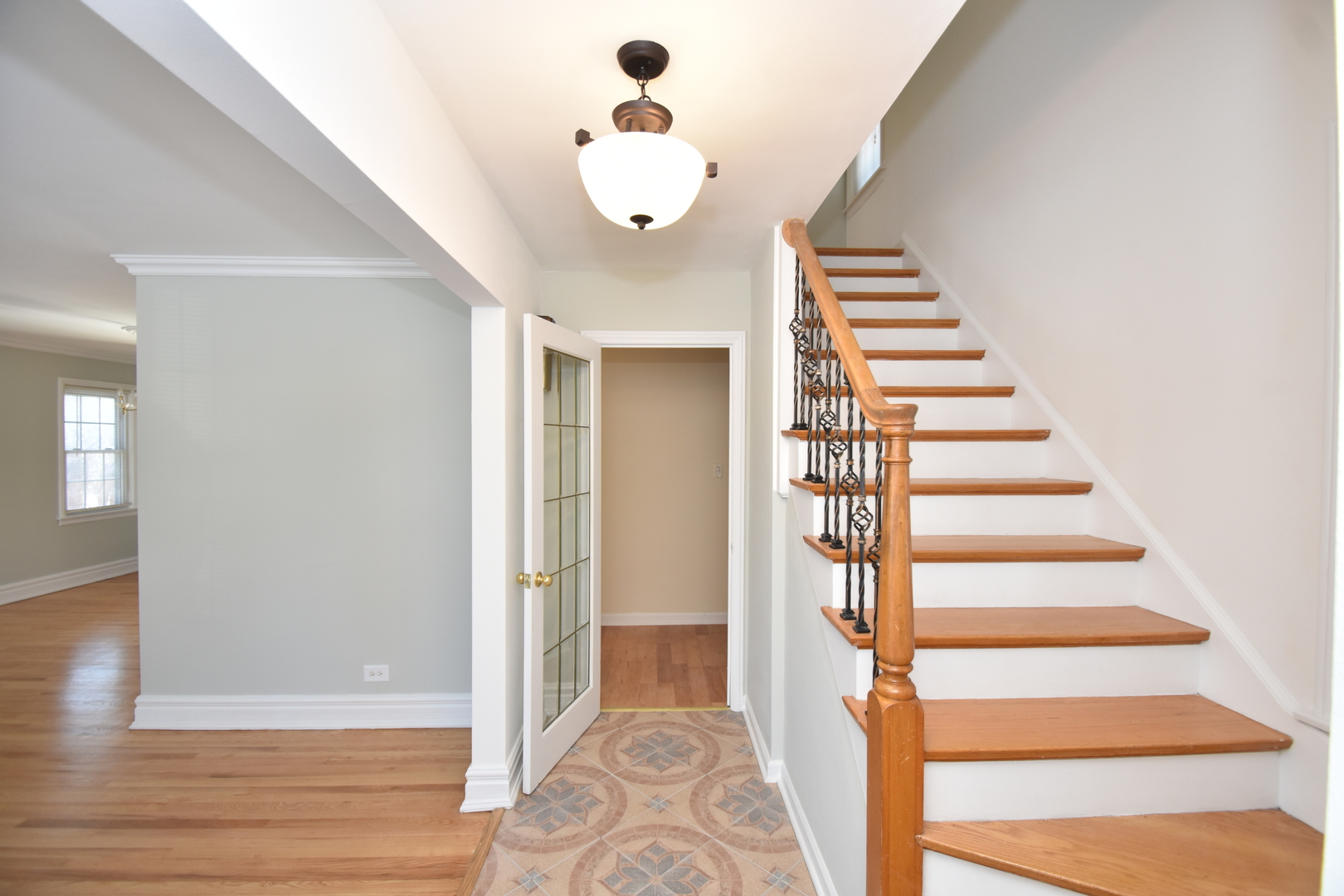 735 East Golf Road Des Plaines, IL 60016 - Photo 3 of 31 a view of a hallway with wooden floor and staircase