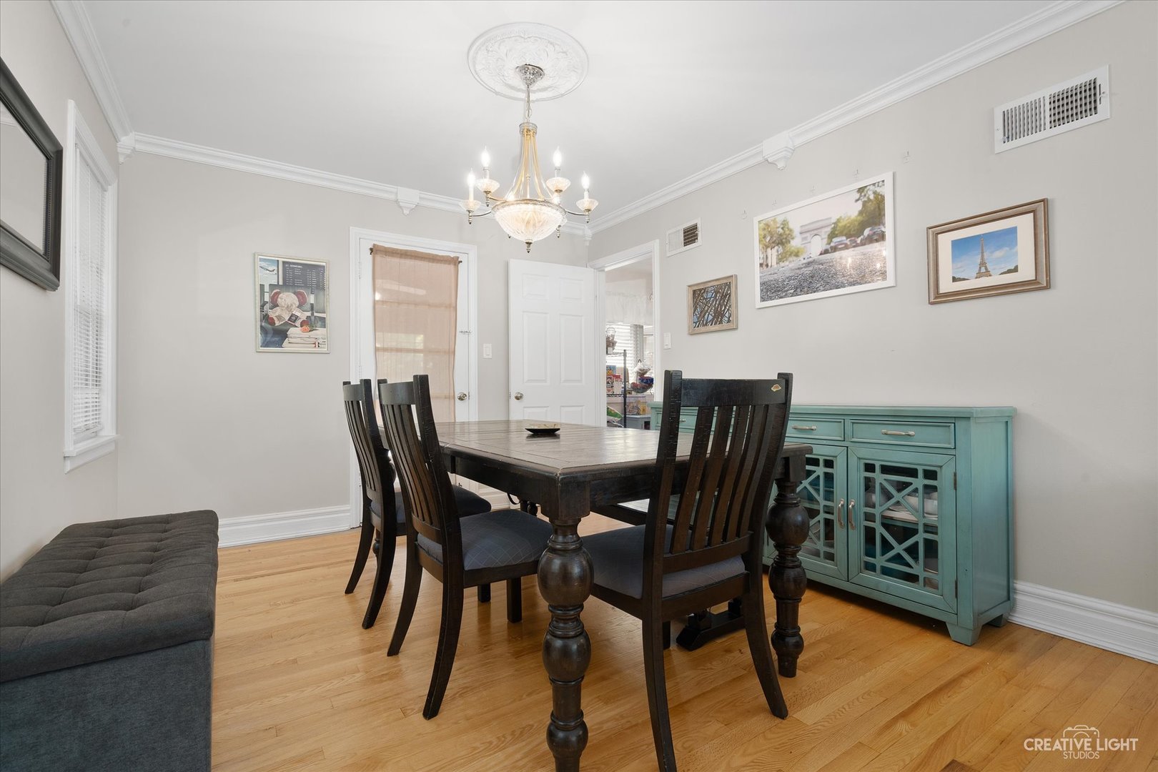 735 East Golf Road Des Plaines, IL 60016 - Photo 7 of 31 a view of a dining room with furniture a chandelier and wooden floor