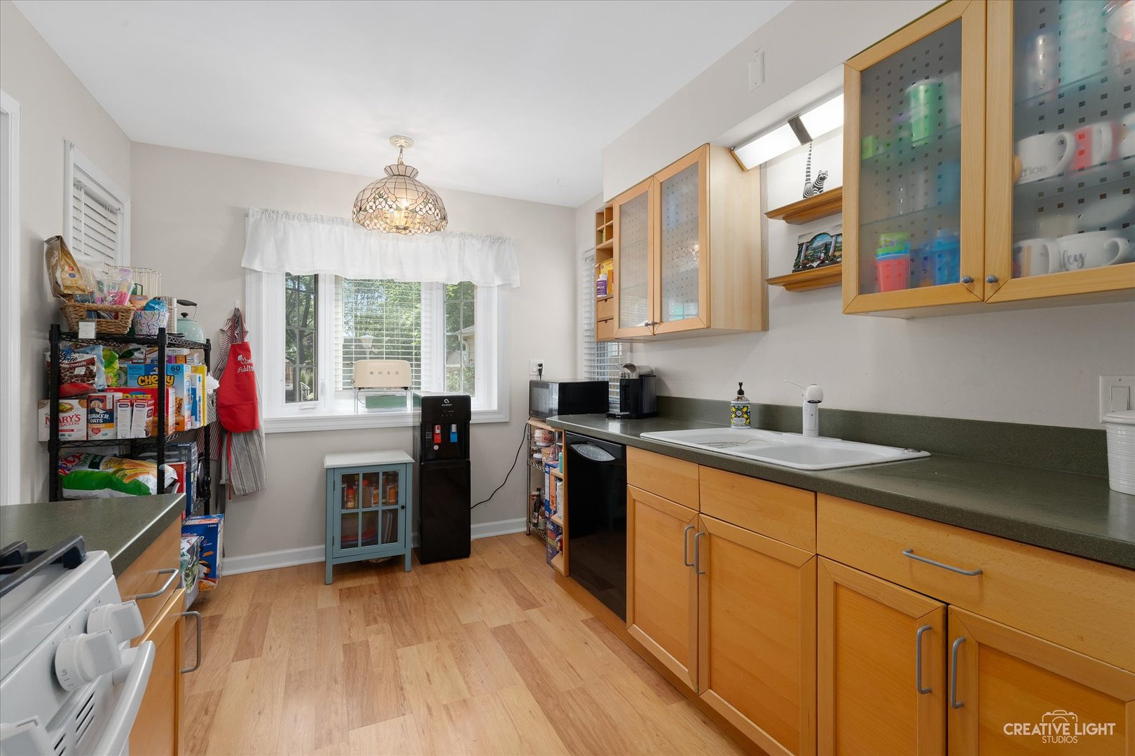 735 East Golf Road Des Plaines, IL 60016 - Photo 8 of 31 a kitchen with sink cabinets and window