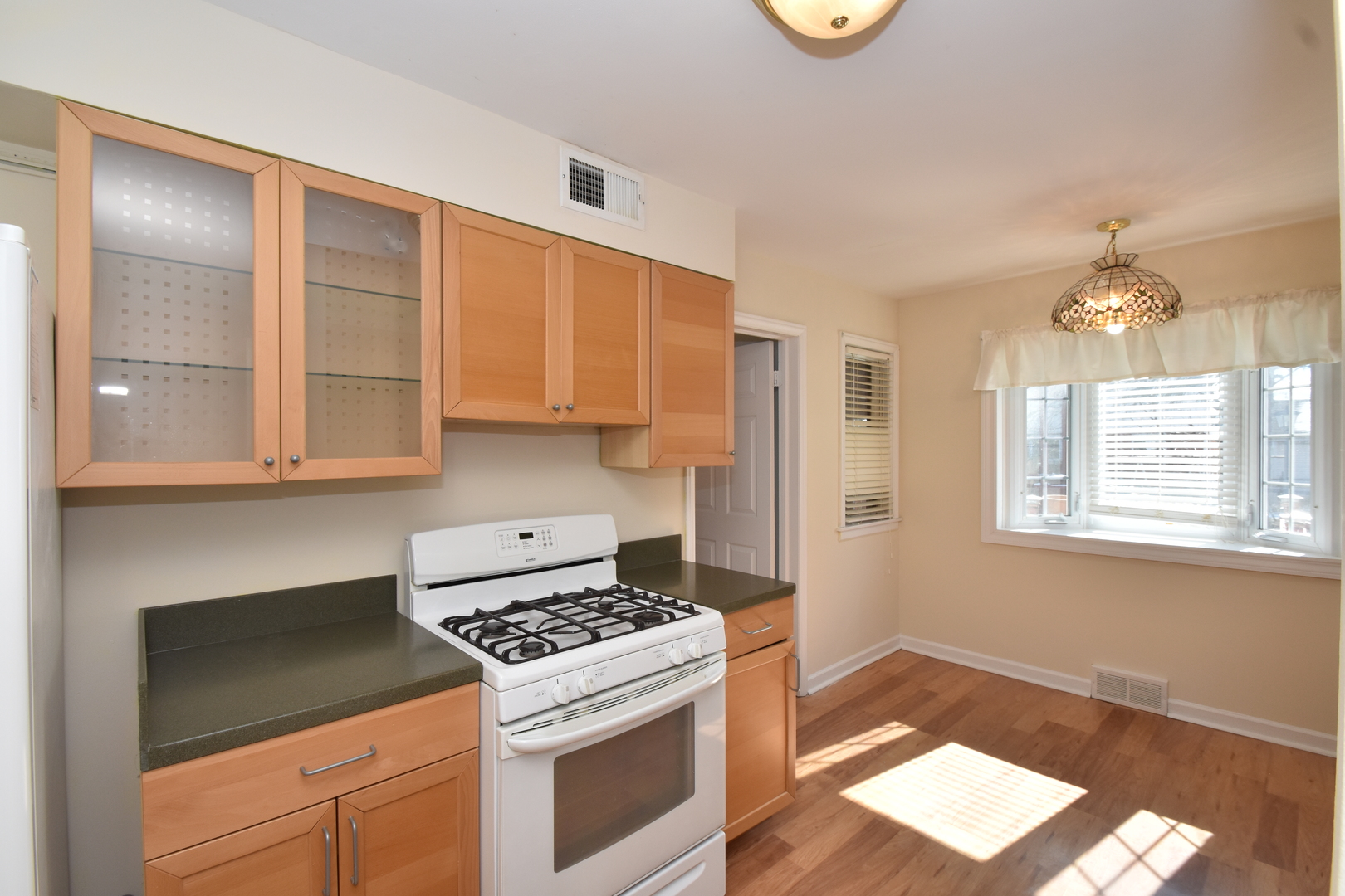 735 East Golf Road Des Plaines, IL 60016 - Photo 10 of 31 a kitchen with a stove and a refrigerator