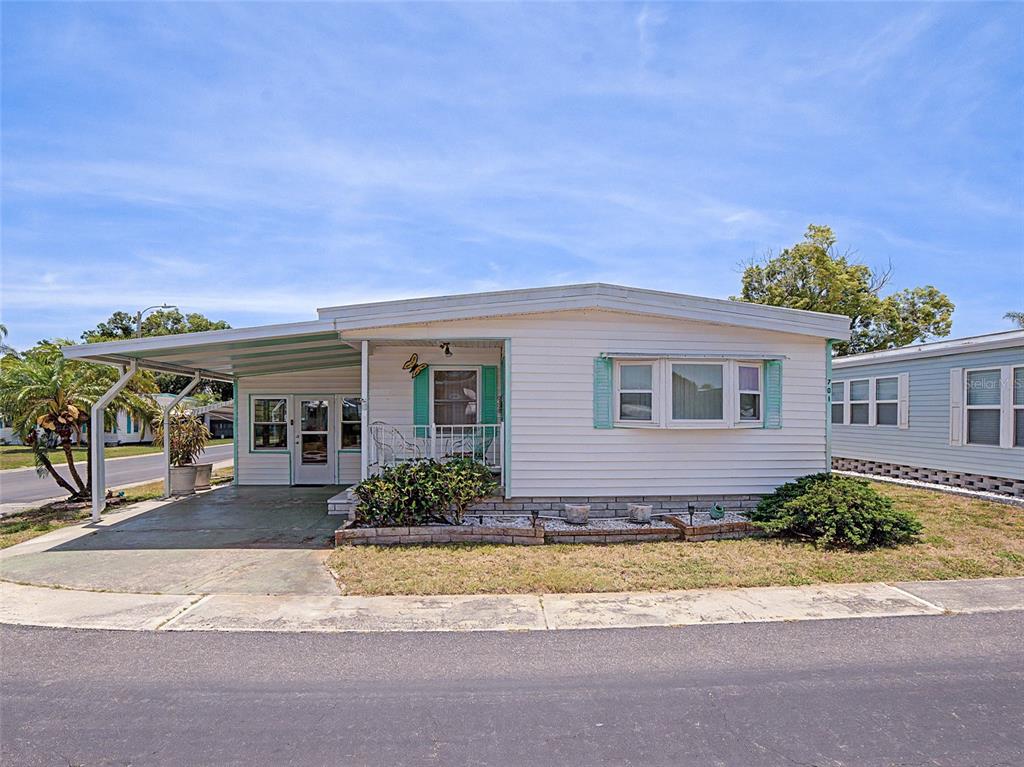 701 Sugar Palm Street Largo, FL 33770 - Photo 1 of 35 a front view of a house with a yard