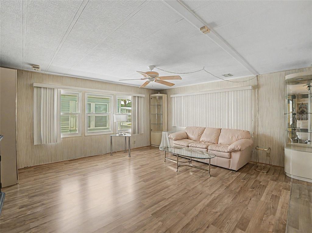 701 Sugar Palm Street Largo, FL 33770 - Photo 11 of 35 a living room with furniture and a wooden floor