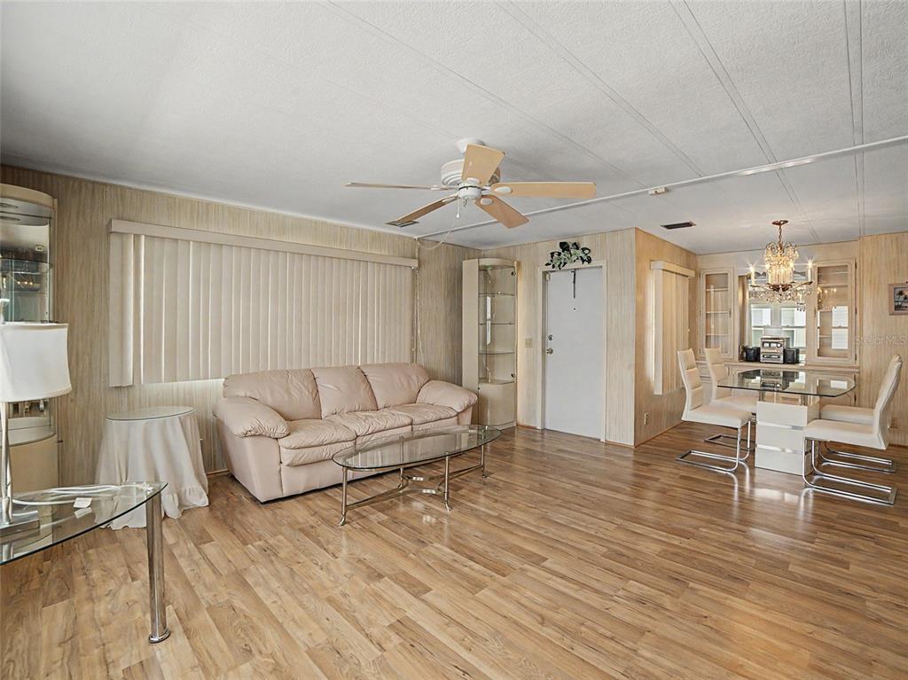 701 Sugar Palm Street Largo, FL 33770 - Photo 12 of 35 a living room with furniture and a wooden floor