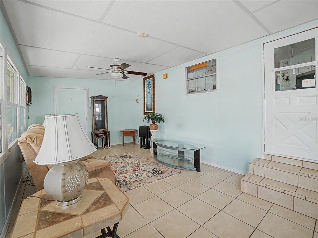 701 Sugar Palm Street Largo, FL 33770 - Photo 20 of 35 a bedroom with a bed and a table