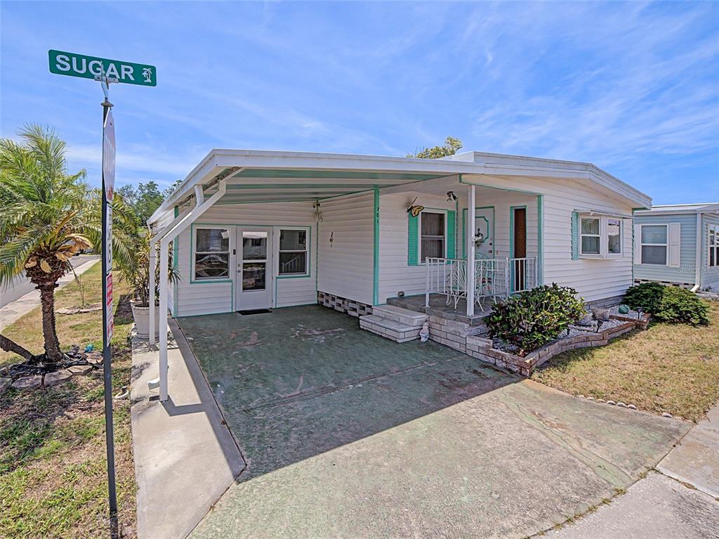 701 Sugar Palm Street Largo, FL 33770 - Photo 2 of 35 a front view of a house with garden