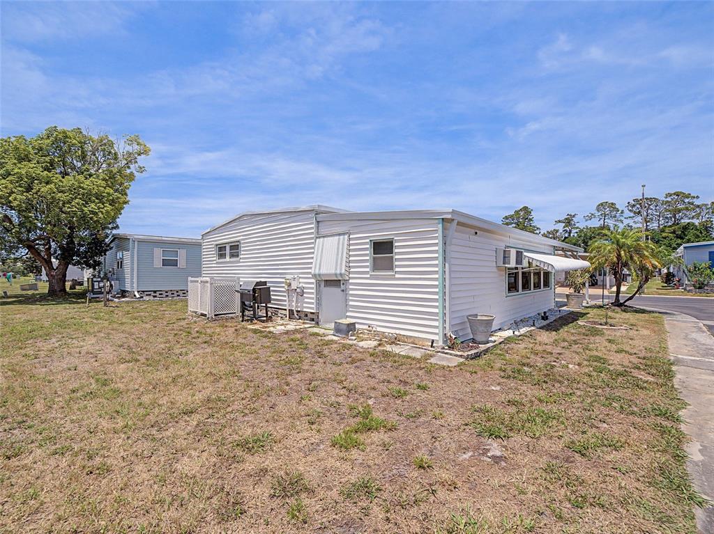 701 Sugar Palm Street Largo, FL 33770 - Photo 25 of 35 a view of a house with a backyard