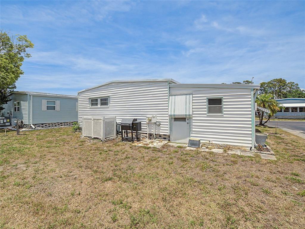 701 Sugar Palm Street Largo, FL 33770 - Photo 26 of 35 a backyard of a house