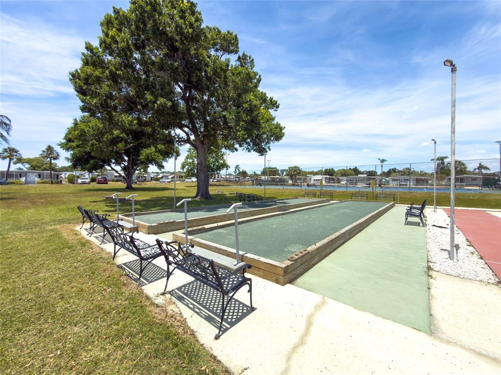 701 Sugar Palm Street Largo, FL 33770 - Photo 32 of 35 a view of a swimming pool with a lounge chairs
