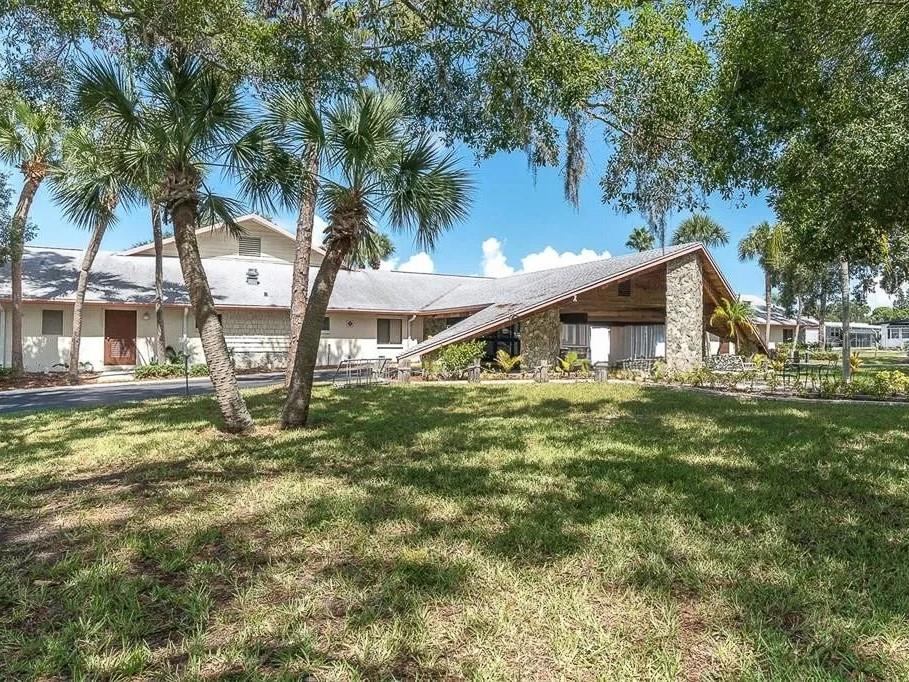 701 Sugar Palm Street Largo, FL 33770 - Photo 35 of 35 a view of a house with a yard and sitting area