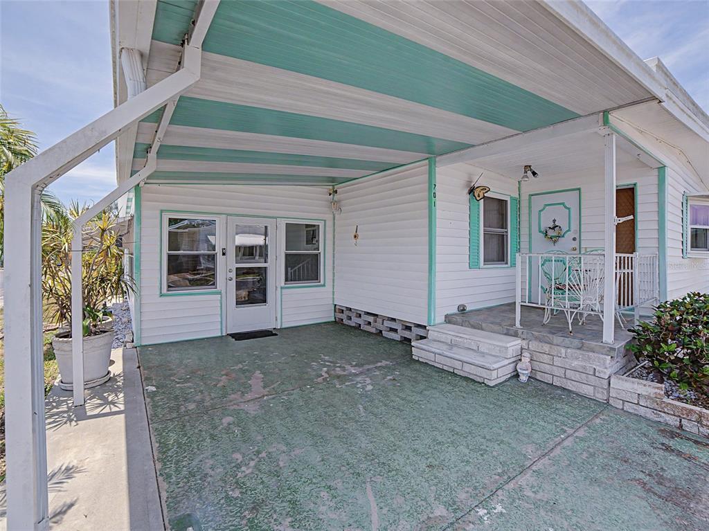 701 Sugar Palm Street Largo, FL 33770 - Photo 4 of 35 a view of a house with a large window and wooden fence