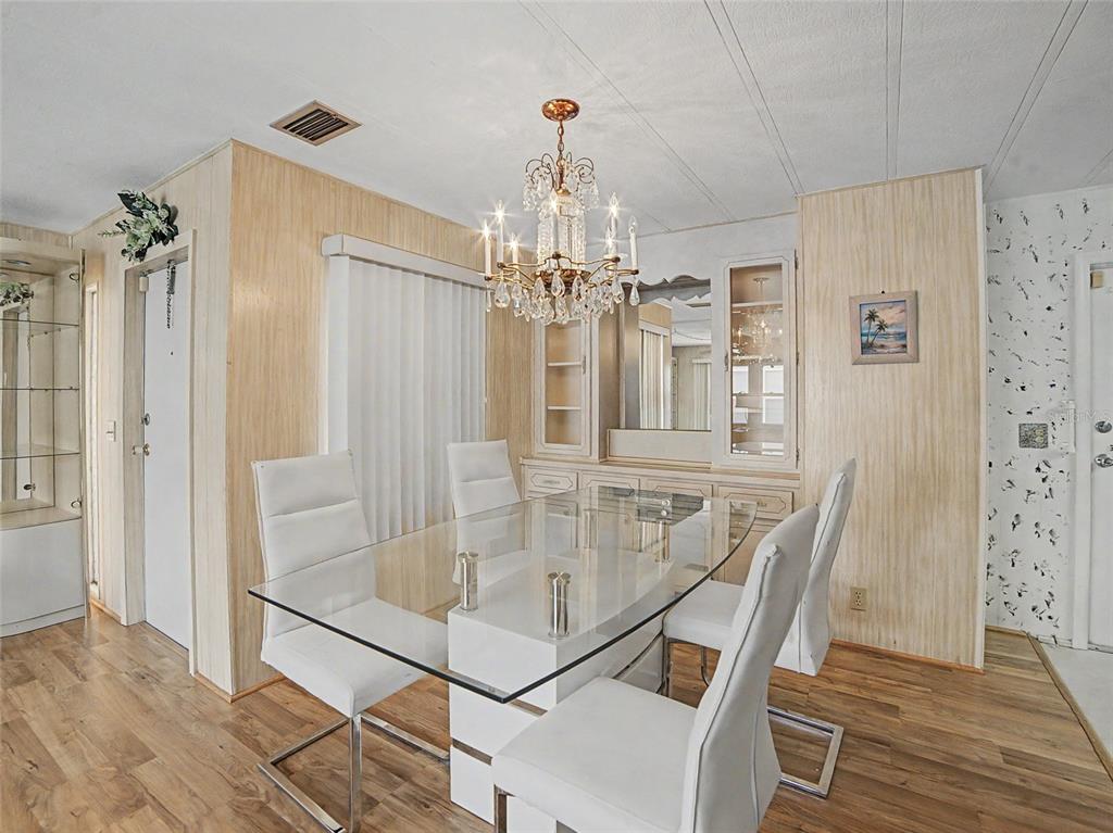 701 Sugar Palm Street Largo, FL 33770 - Photo 8 of 35 a view of a dining room with furniture and chandelier