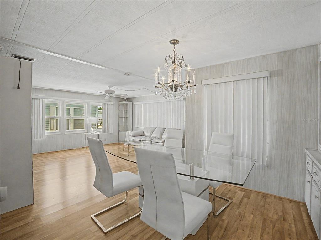 701 Sugar Palm Street Largo, FL 33770 - Photo 9 of 35 a view of a livingroom with furniture and chandelier