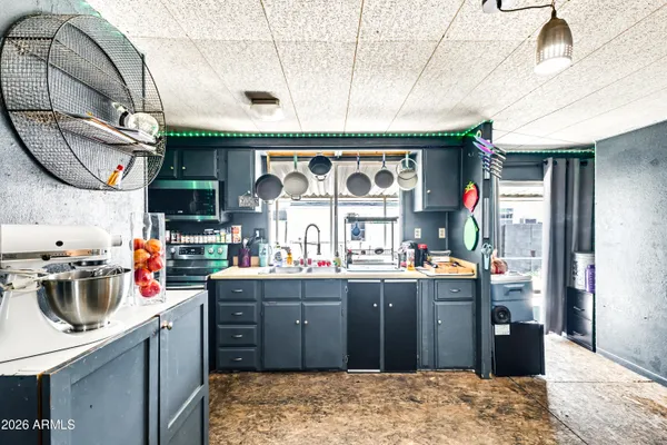 a kitchen with a sink and appliances
