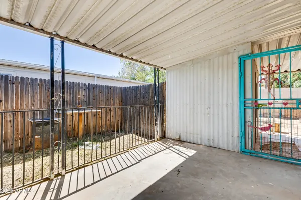 a view of balcony with floor to ceiling window