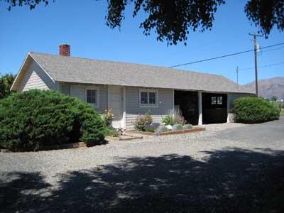 1360 Dilley Road Tieton, WA 98947 - Photo 17 of 23 a front view of a house with a garden