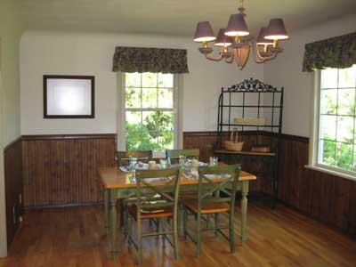1360 Dilley Road Tieton, WA 98947 - Photo 7 of 23 a view of a dining room with furniture a chandelier and wooden floor
