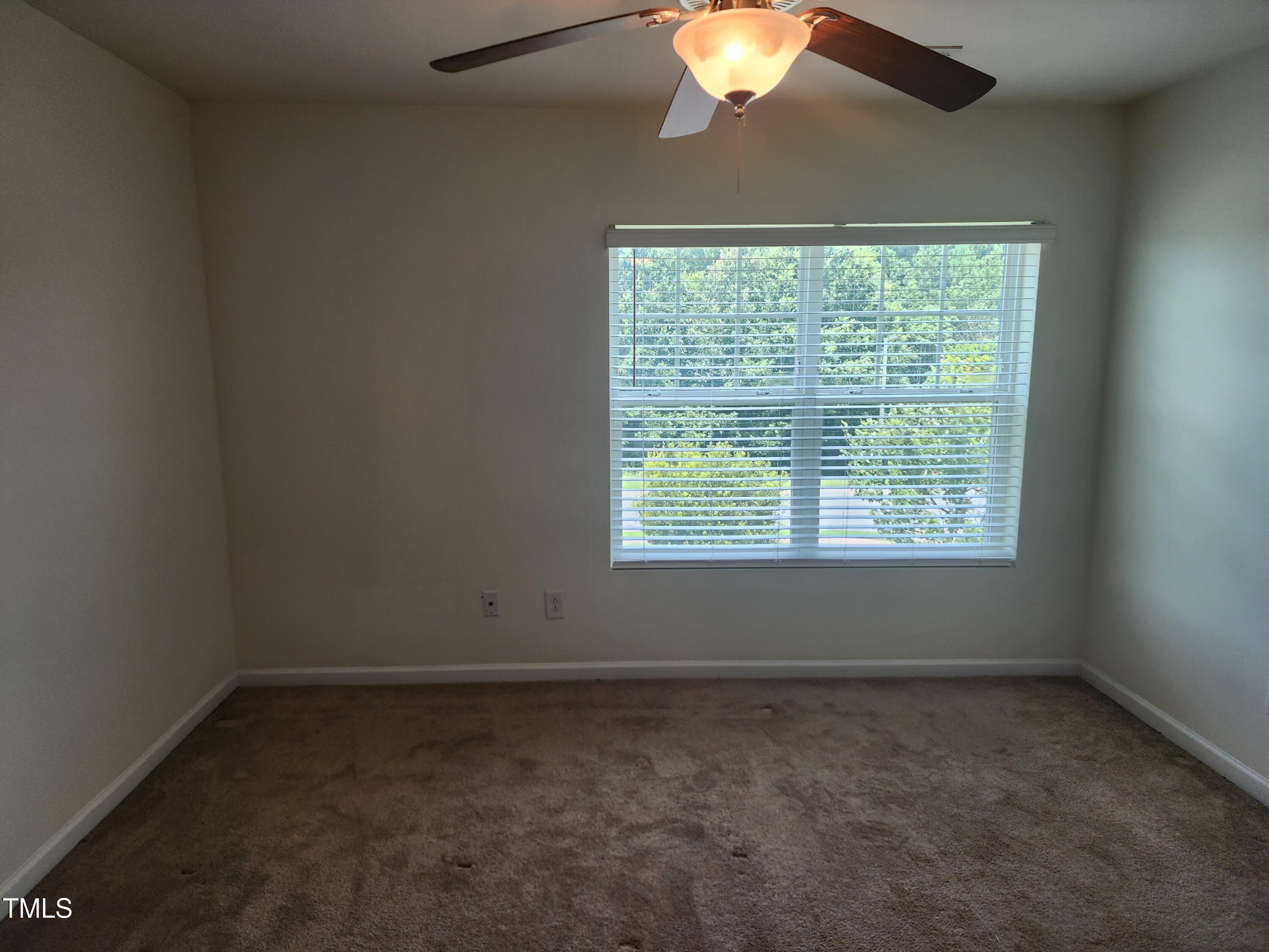 1304-107 Cozart Street, Unit 107 Durham, NC 27704 - Photo 13 of 15 an empty room with a window