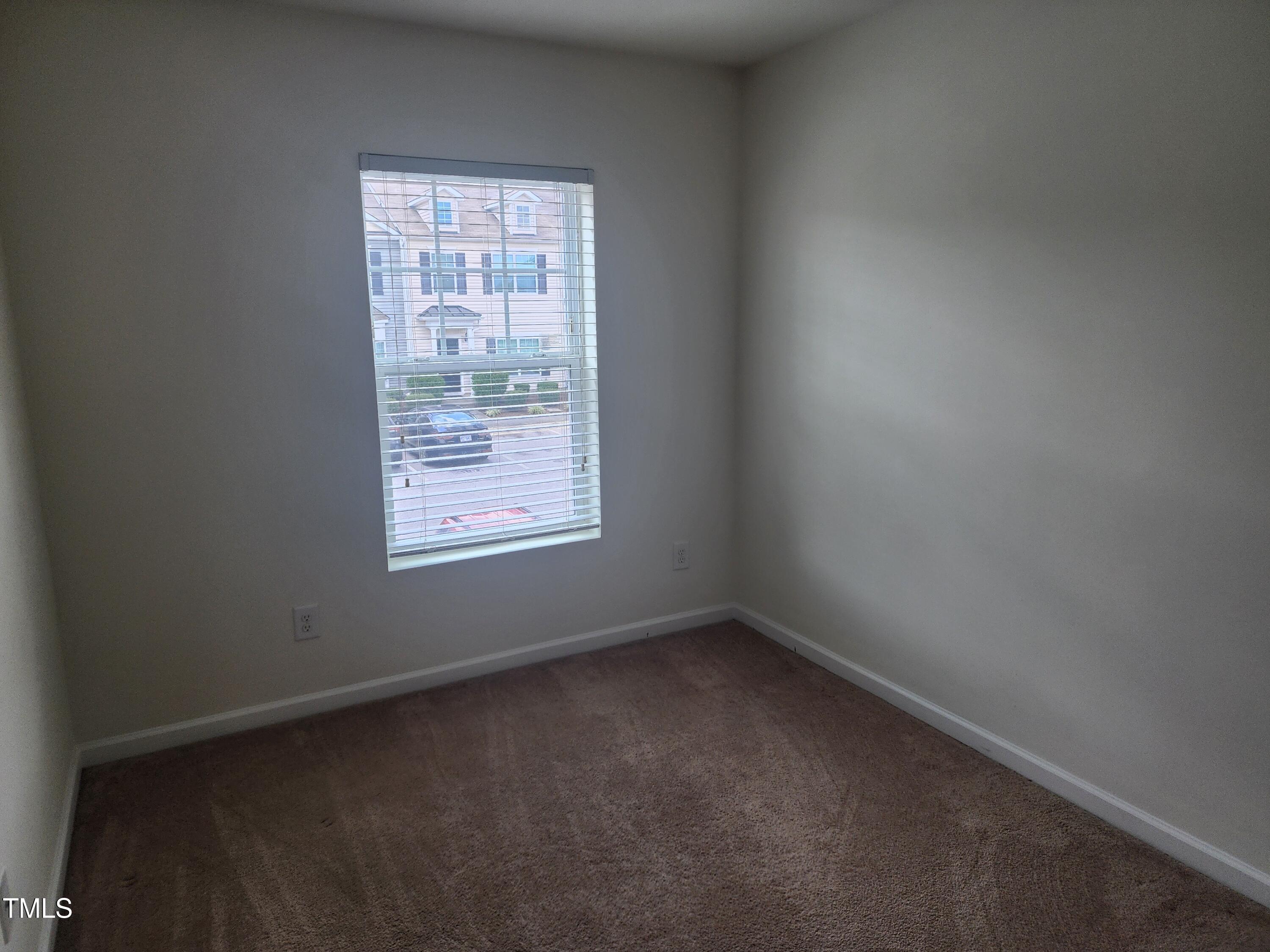1304-107 Cozart Street, Unit 107 Durham, NC 27704 - Photo 14 of 15 a view of an empty room with a window