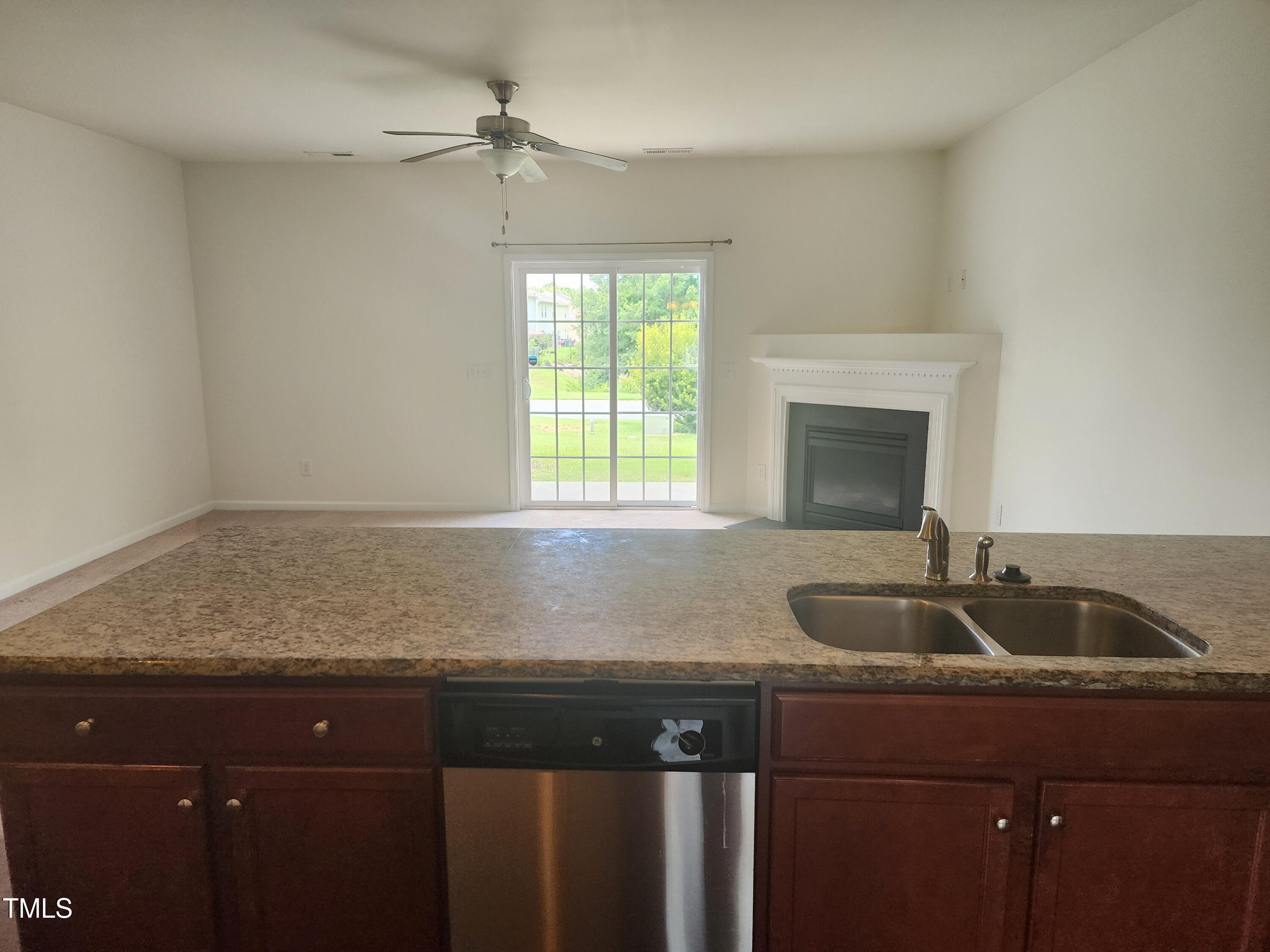1304-107 Cozart Street, Unit 107 Durham, NC 27704 - Photo 3 of 15 a kitchen with granite countertop a sink and a window