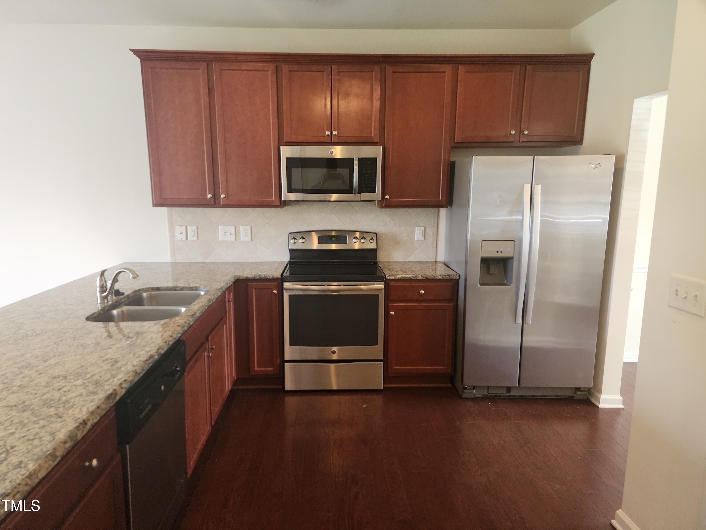 1304-107 Cozart Street, Unit 107 Durham, NC 27704 - Photo 4 of 15 a kitchen with a sink appliances and cabinets