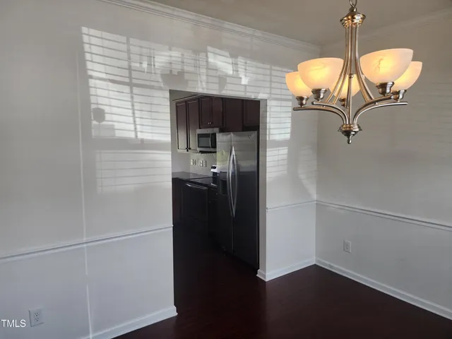 a room view with wooden floor and staircase