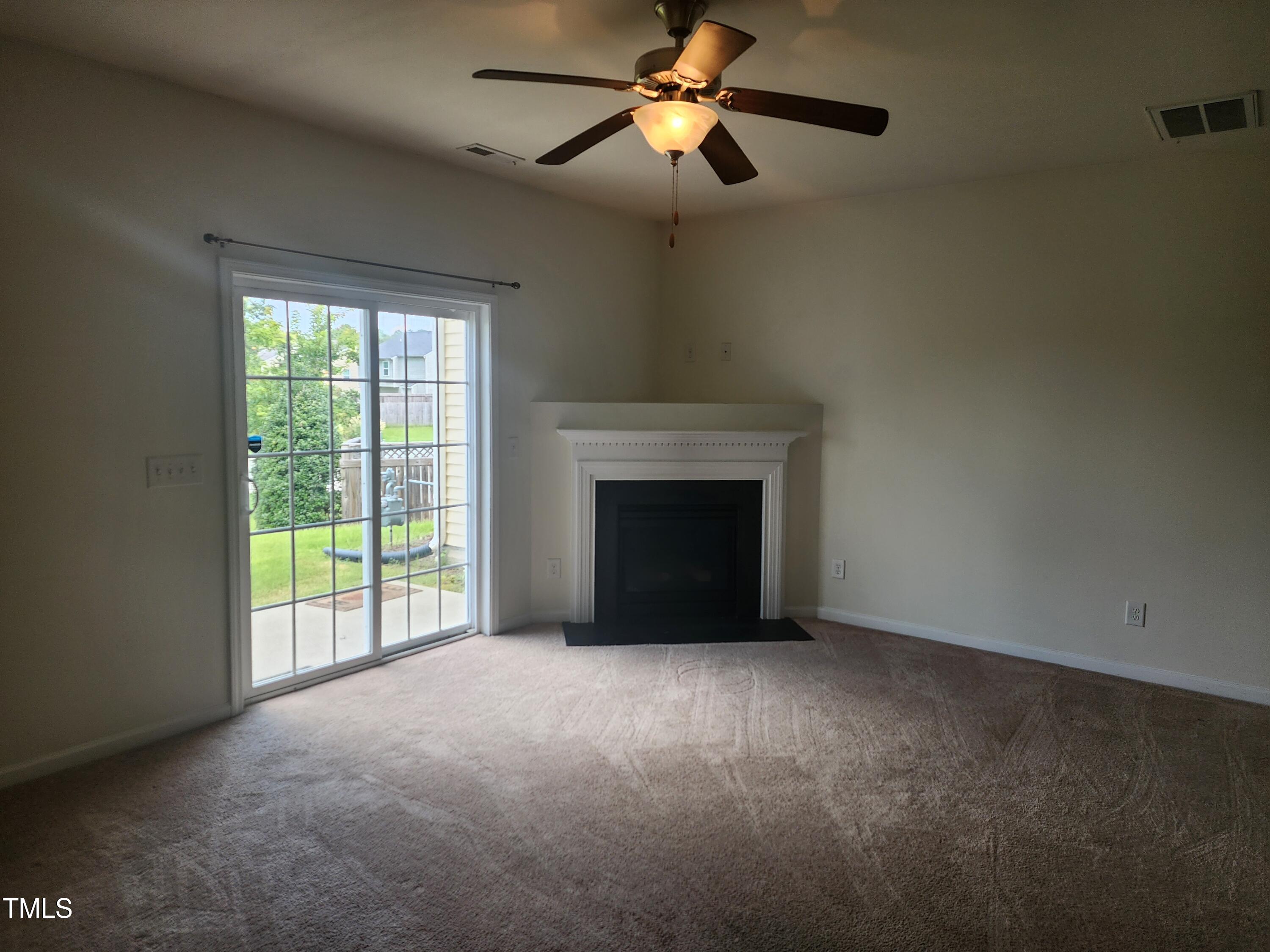 1304-107 Cozart Street, Unit 107 Durham, NC 27704 - Photo 7 of 15 a view of empty room with fireplace