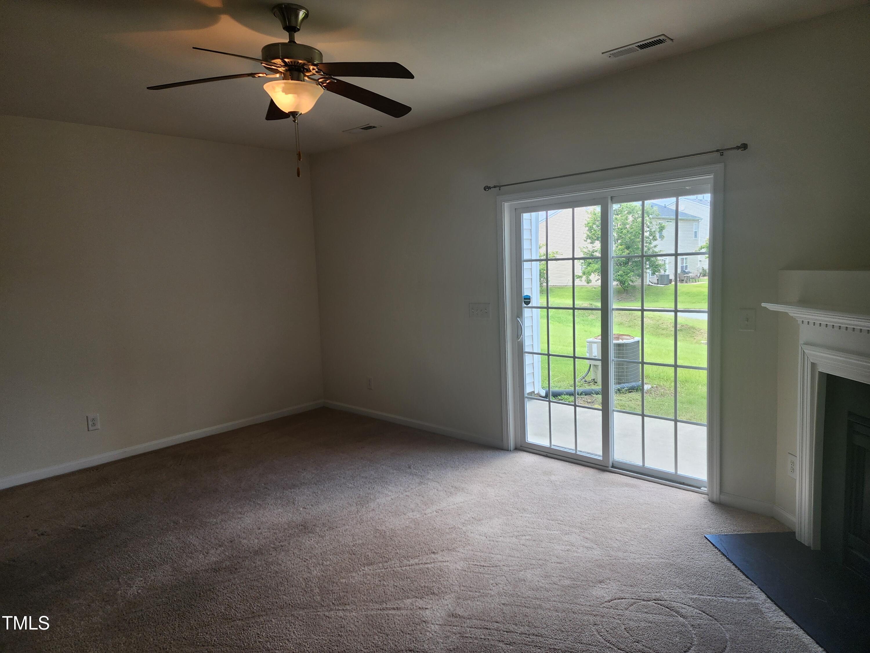 1304-107 Cozart Street, Unit 107 Durham, NC 27704 - Photo 8 of 15 a view of an empty room with a window