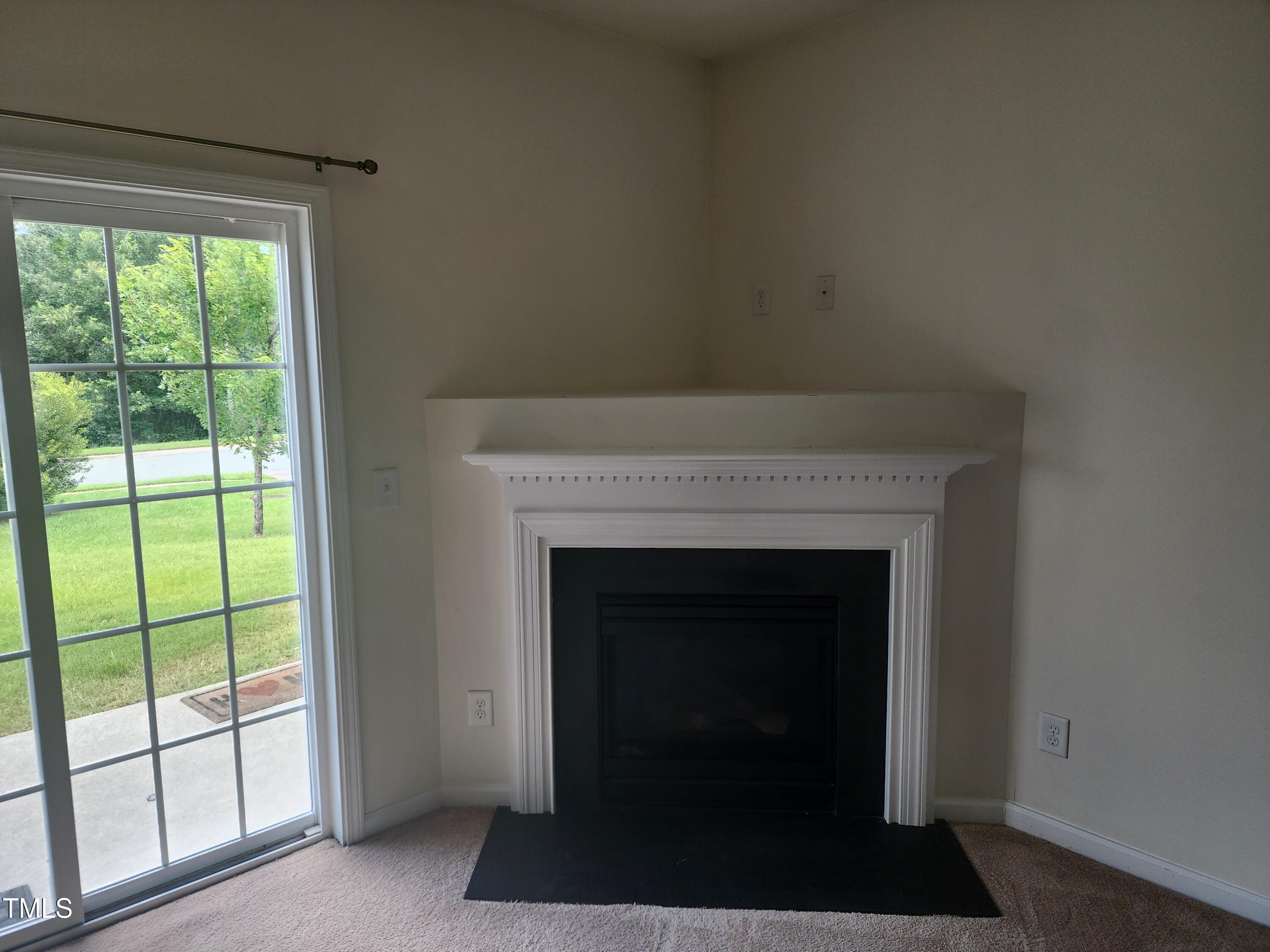 1304-107 Cozart Street, Unit 107 Durham, NC 27704 - Photo 9 of 15 a living room with a fireplace