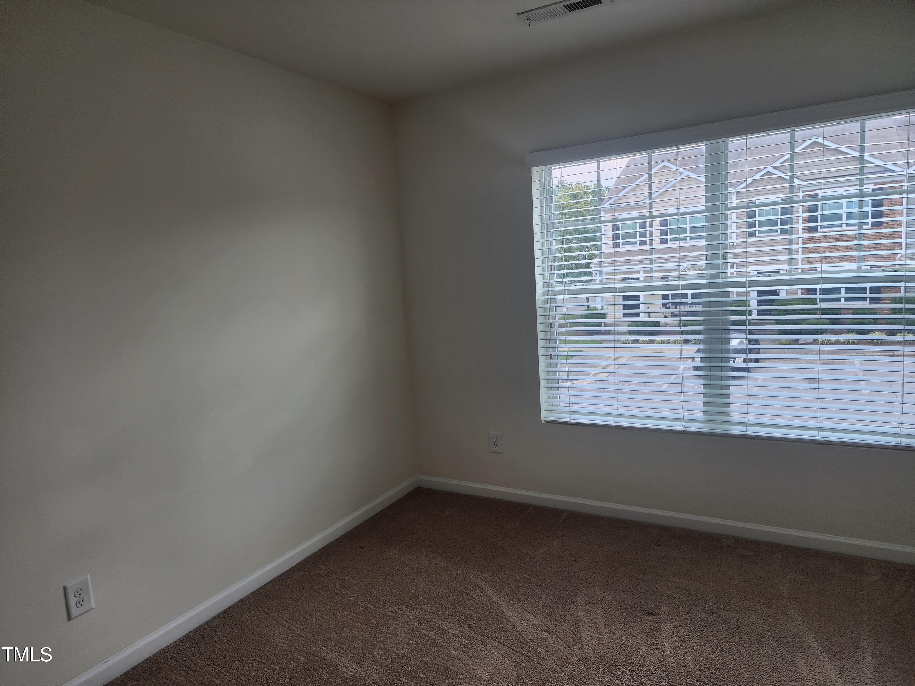 1304-107 Cozart Street, Unit 107 Durham, NC 27704 - Photo 10 of 15 a view of an empty room with a window