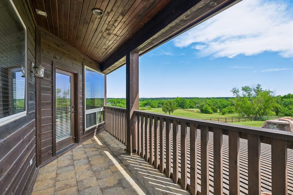 2085 Switzer Road Sanger, TX 76266 - Photo 16 of 39 Outdoor balcony featuring wood-finish siding, wood-plank ceiling, and a tile floor