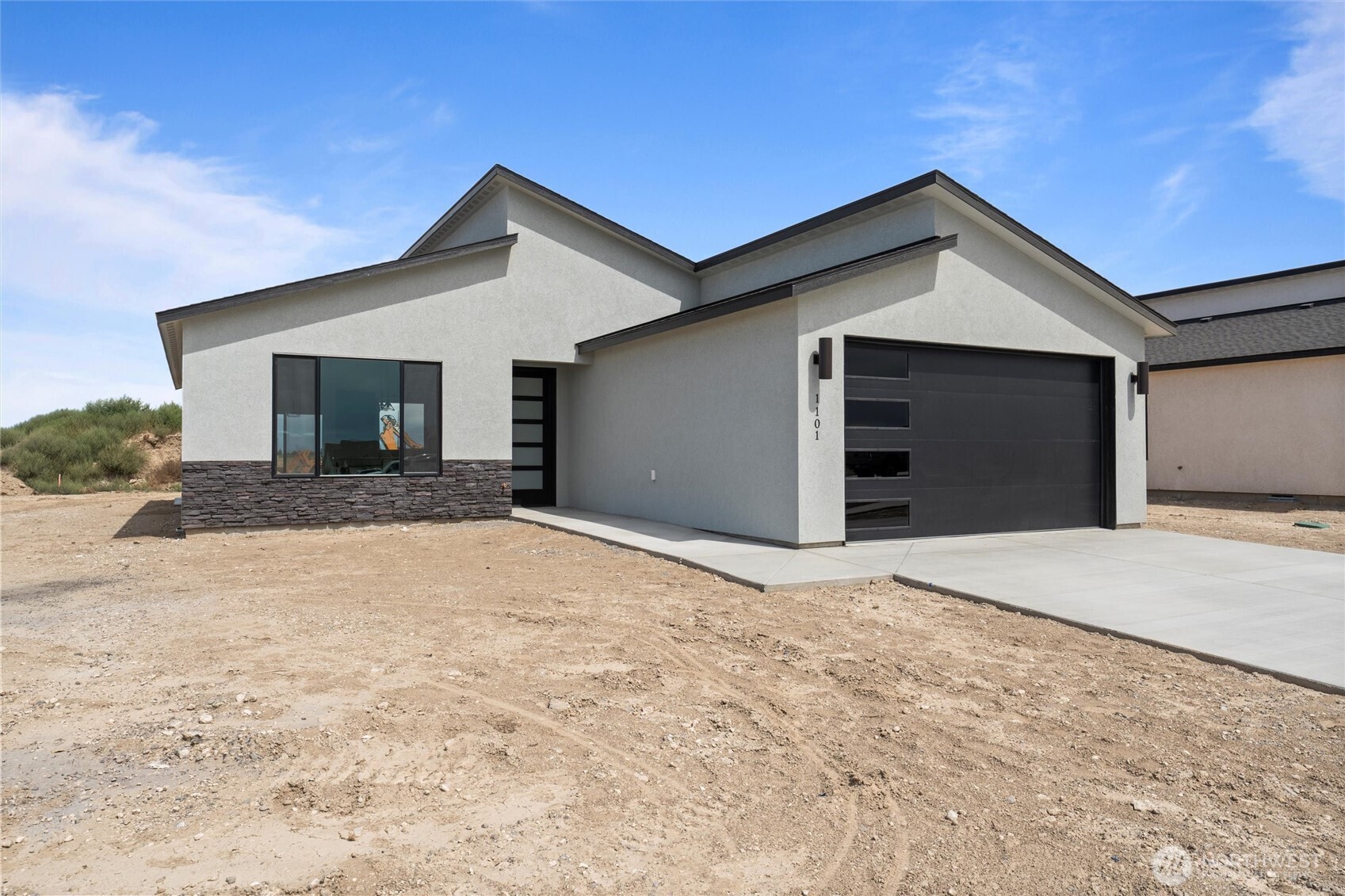 1154 E Mount Othello, WA 99344 - Photo 2 of 33 a view of a house with a yard and garage
