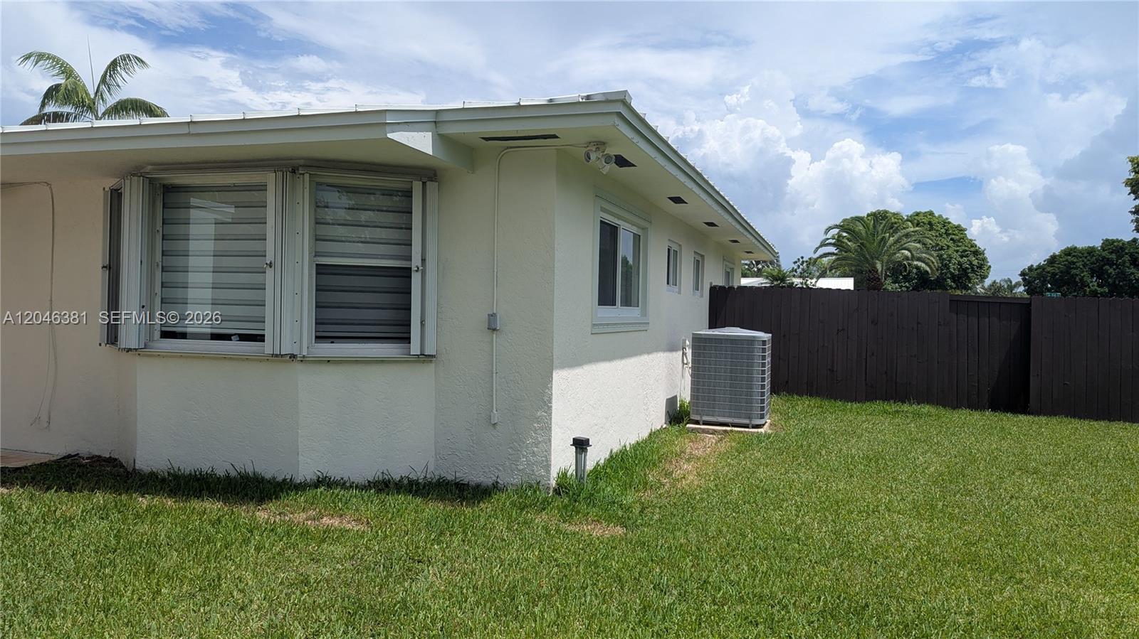 10442 Southwest 114th Street Miami, FL 33176 - Photo 15 of 48 SE corner of house; A/C condenser unit