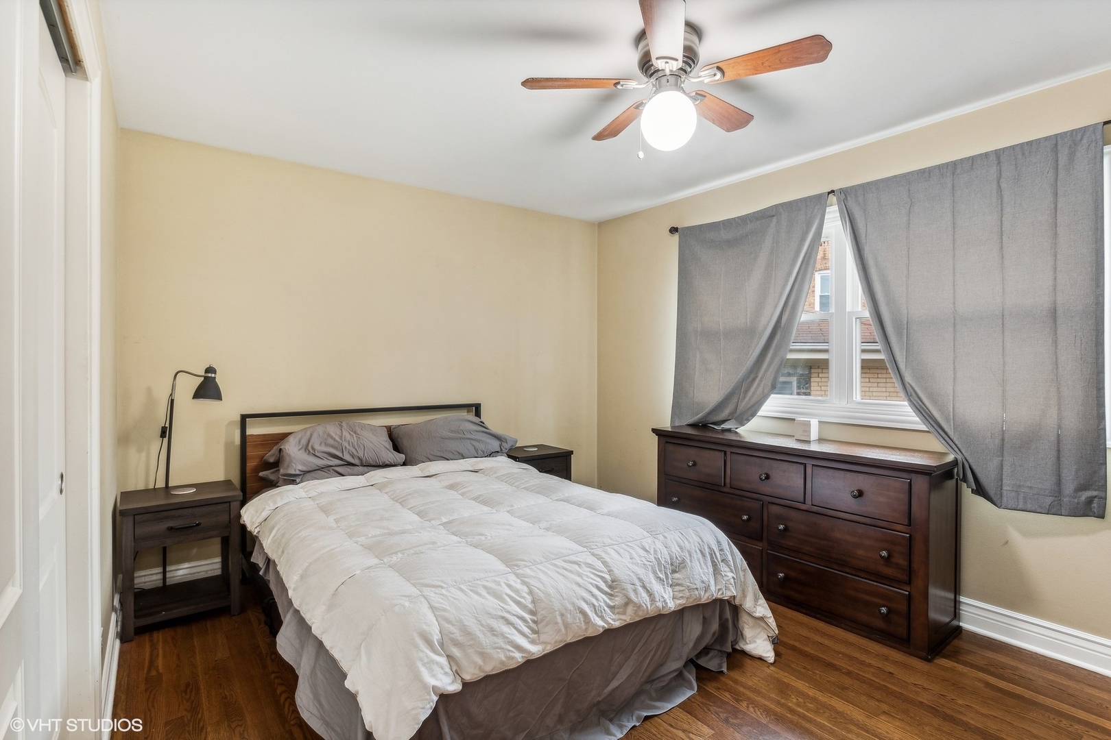 9001 East Prairie Road Evanston, IL 60203 - Photo 7 of 19 a bedroom with a bed and a chandelier