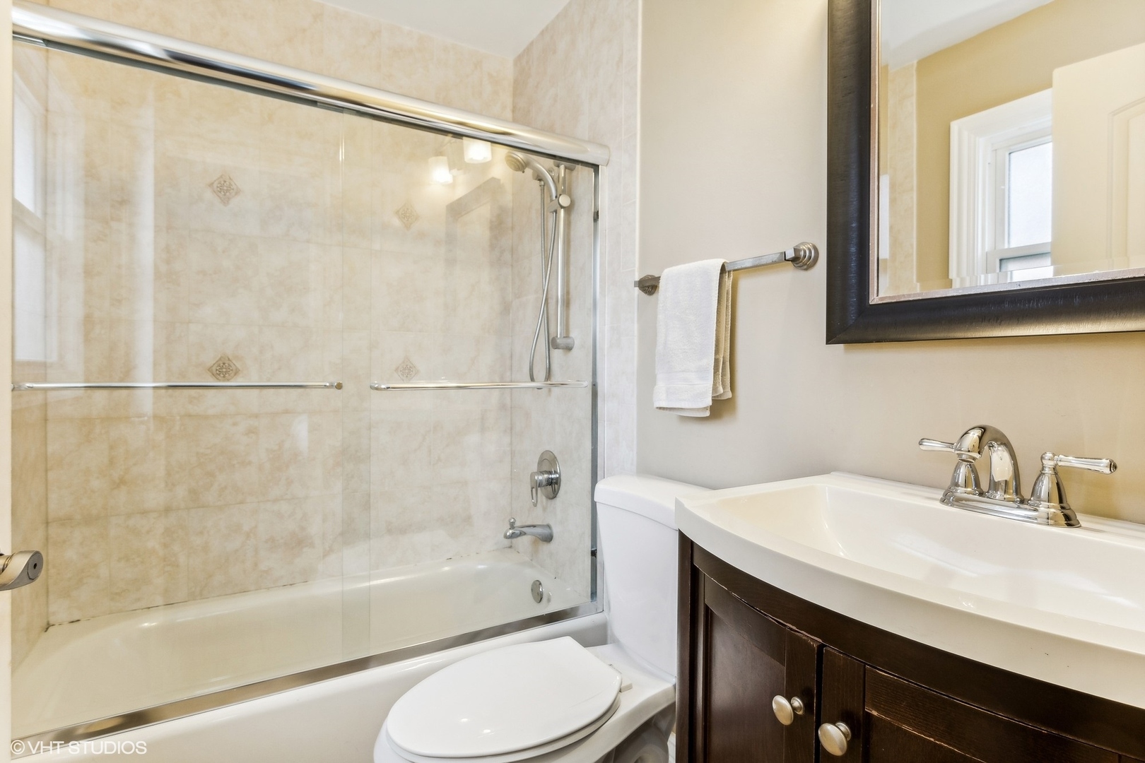 9001 East Prairie Road Evanston, IL 60203 - Photo 9 of 19 a bathroom with a sink toilet and shower