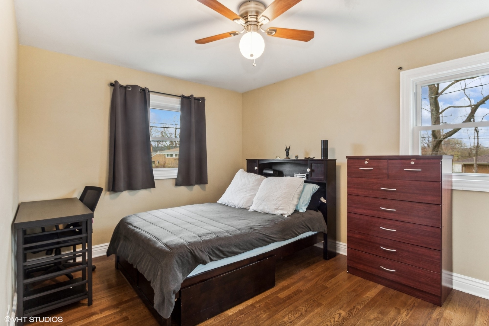 9001 East Prairie Road Evanston, IL 60203 - Photo 10 of 19 a bedroom with a bed and a chandelier