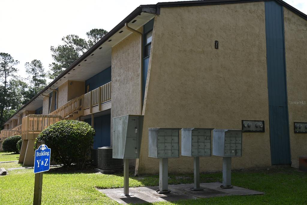 2811 Southwest Archer Road, Unit Y217 Gainesville, FL 32608 - Photo 5 of 8 a street sign on the side of building