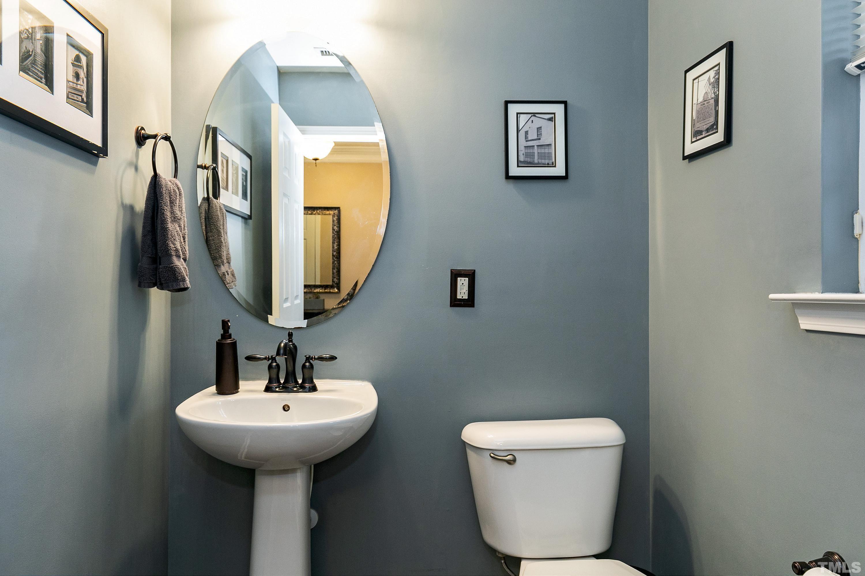 160 Solheim Lane Raleigh, NC 27603 - Photo 12 of 33 a bathroom with a toilet sink and mirror