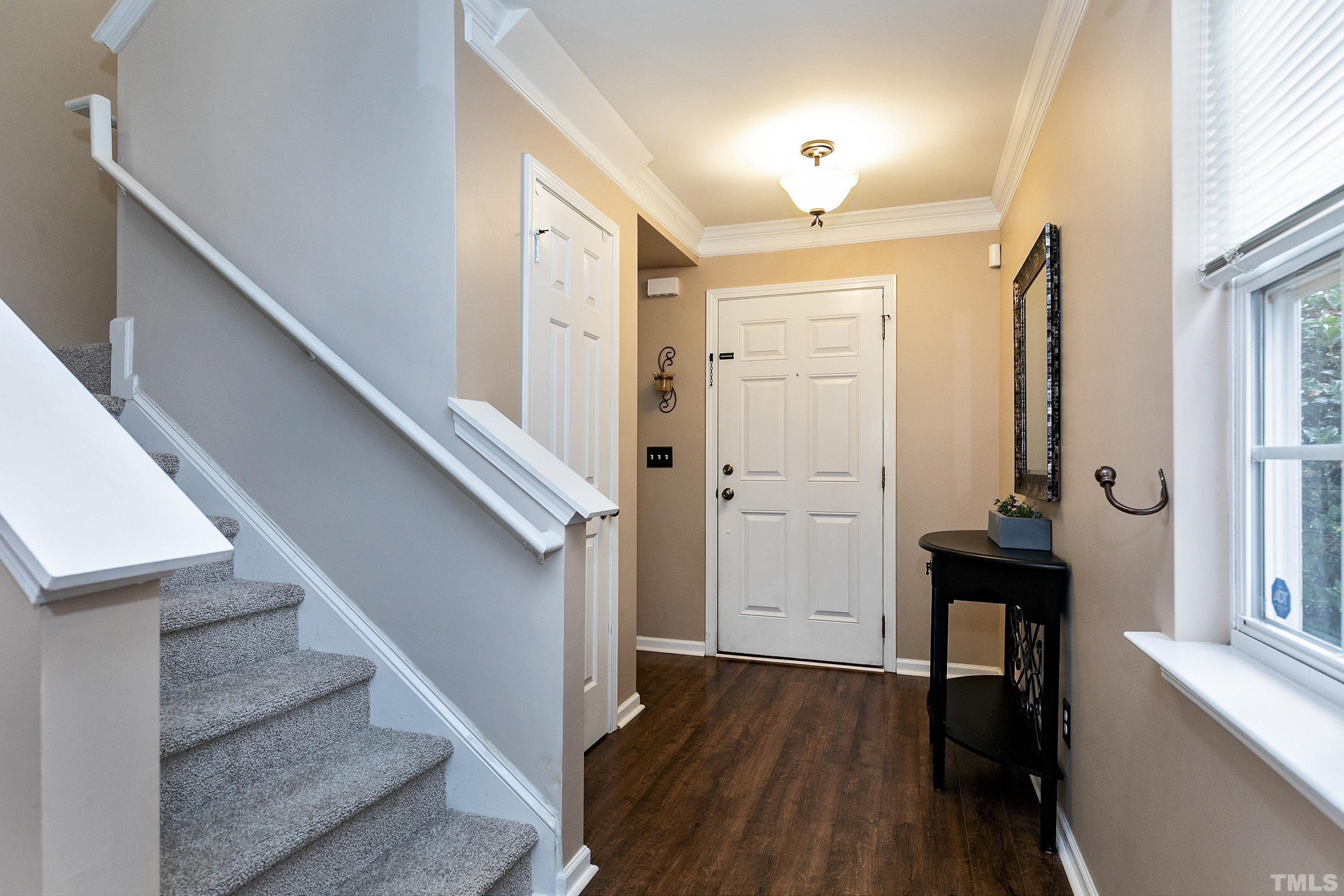 160 Solheim Lane Raleigh, NC 27603 - Photo 15 of 33 a view of a hallway with wooden floor and staircase